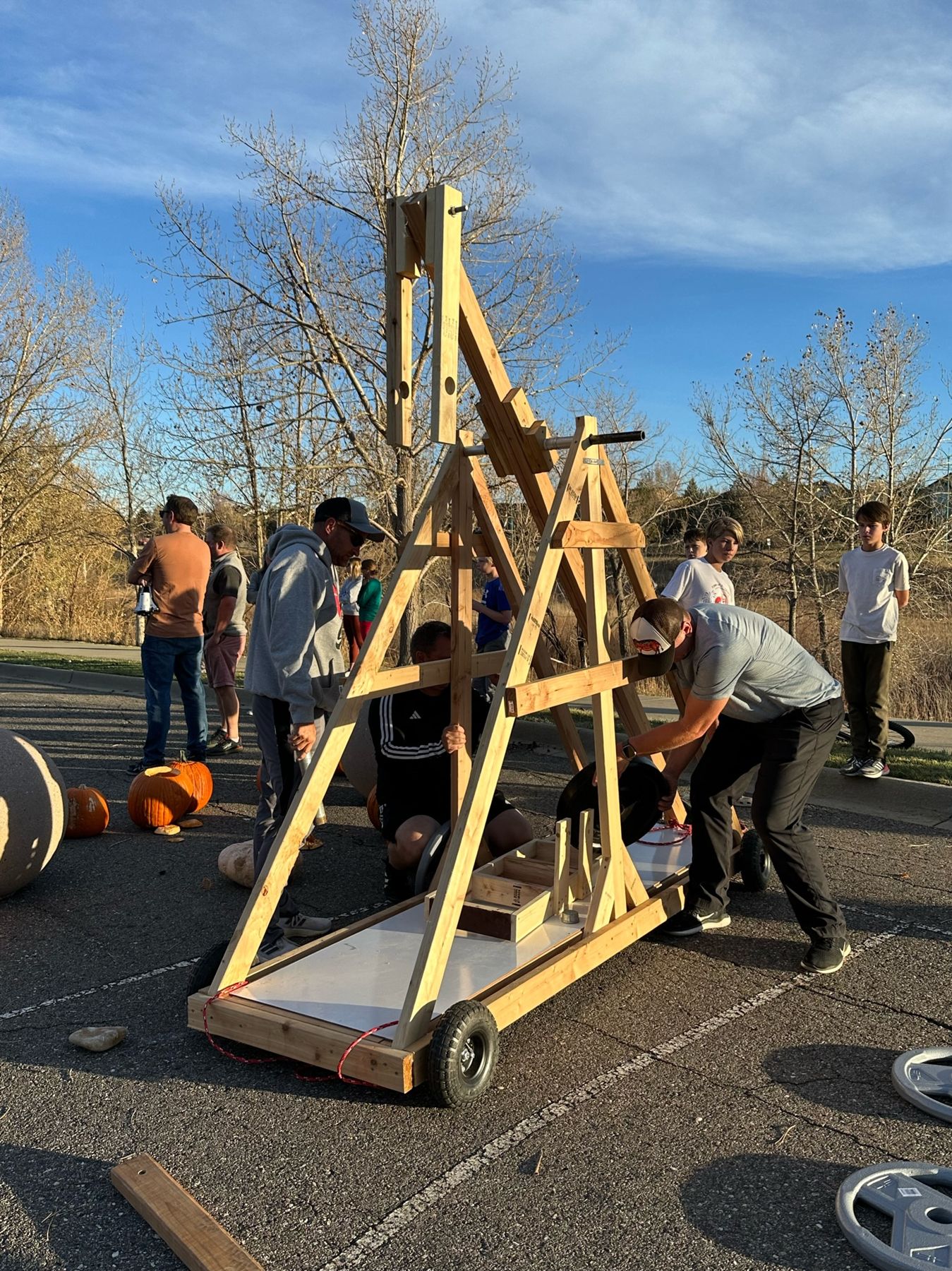 The 2023 trebuchet in a parking lot, three-quarter view